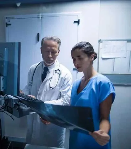 Medical professionals reviewing patient imaging