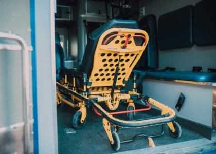 Ambulance interior featuring a yellow stretcher, emphasizing emergency wound care and transport for patients with non-healing wounds.